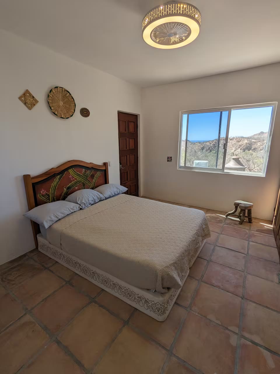 Bedroom with queen bed and desert view