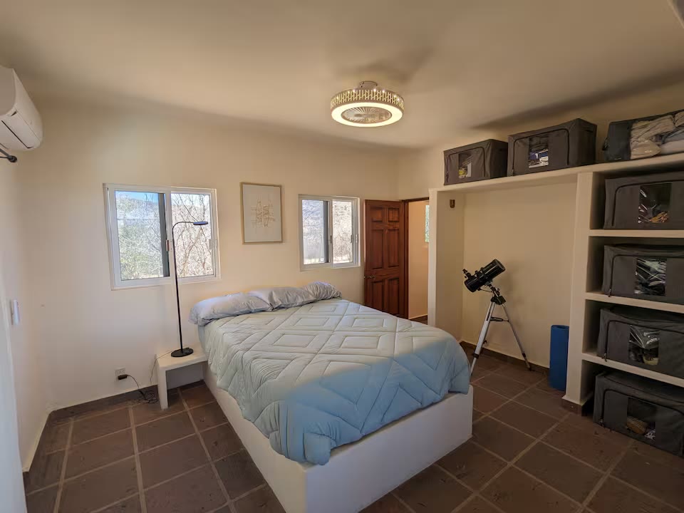 Second bedroom with AC and shelving
